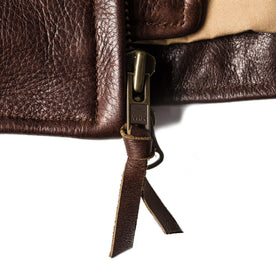material shot of the zipper on The Moto Jacket in Espresso Steerhide