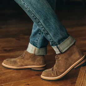 fit model showing off the side detail of The Rambler Chukka in Mushroom Suede