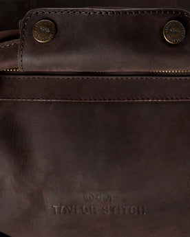 material shot of the leather handle with snap closure, Accessories by Taylor Stitch