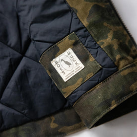 material shot of the Boss Duck logo on The Workhorse Vest in Camo Boss Duck
