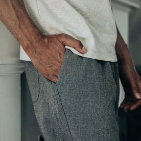 fit model with his hand in his pocket of The Apres Pant in Heather Grey Double Cloth