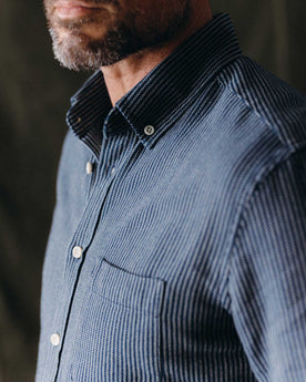 fit model adjusting the sleeves of The Jack in Roped Indigo, Wovens by Taylor Stitch