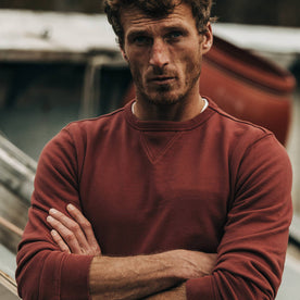 fit model wearing The Crewneck in Brick Red Terry, arms crossed