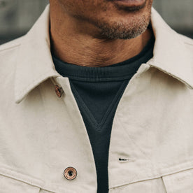 fit model wearing The Long Haul Jacket in Natural Organic Selvage, cropped chest shot