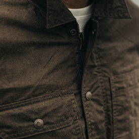 fit model wearing The Longshore Jacket in Dark Oak Waxed Canvas, cropped of chest