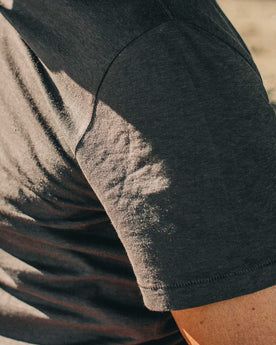 our fit model wearing The Standard Issue Tee in Charcoal Hemp—sleeve shot, Knits by Taylor Stitch