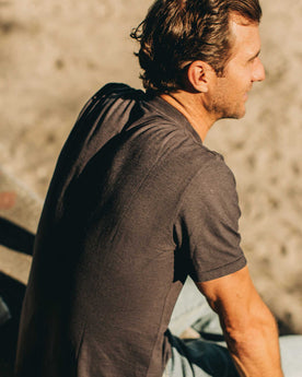 our fit model wearing The Standard Issue Tee in Charcoal Hemp—back shot at an angle, Knits by Taylor Stitch