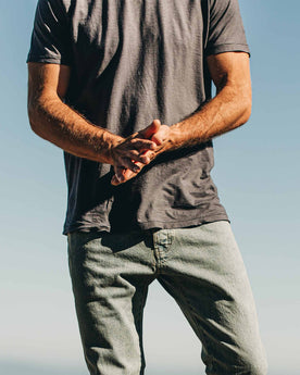 our fit model wearing The Standard Issue Tee in Navy Hemp—cropped shot from chest down, Knits by Taylor Stitch