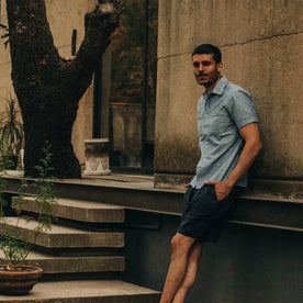 fit model wearing The Tulum in Blue Chambray, hands in pockets