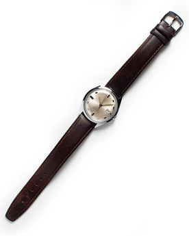 flatlay of The 1970 Timex 21, Accessories by Taylor Stitch