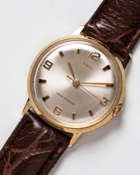flatlay of the 1969 Timex Marlin, shown close up, Accessories by Taylor Stitch