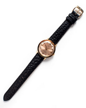 flatlay of The 1972 Timex Marlin Gold, Accessories by Taylor Stitch