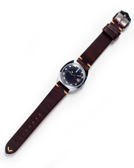 flatlay of The 1973 Timex Marlin, Accessories by Taylor Stitch