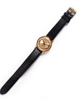 flatlay of The 1974 Timex Mercury Calendar Gold, Accessories by Taylor Stitch