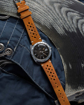 flatlay of the 1976 Timex Electric Dynabeat on a pair of shorts, Accessories by Taylor Stitch