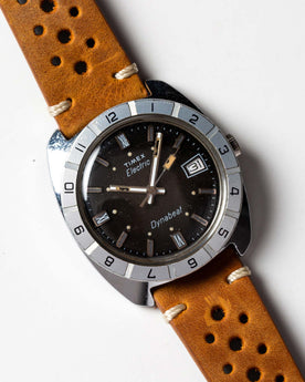 flatlay of 1976 Timex Electric Dynabeat, shown clos eup, Accessories by Taylor Stitch