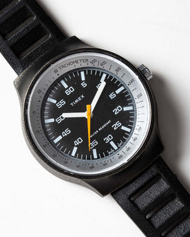 flatlay of the 1977 Timex Black Max, shown close up, Accessories by Taylor Stitch