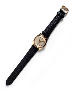 flatlay of the 1978 Timex Gold Marlin, Accessories by Taylor Stitch