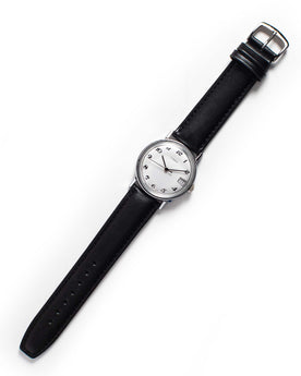 flatlay of the 1978 Timex Mercury, Accessories by Taylor Stitch