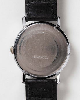 flatlay of the 1978 Timex Mercury, shown from the back, Accessories by Taylor Stitch