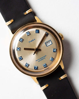 flatlay of the 1975 Timex Viscount, shown close up, Accessories by Taylor Stitch