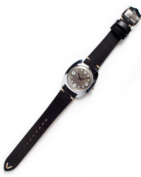 flatlay of the 1975 Timex Electric Dynabeat "Rotary", Accessories by Taylor Stitch