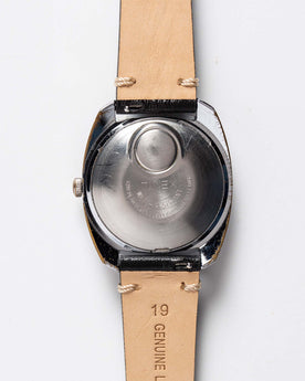 flatlay of 1975 Timex Electric Dynabeat "Rotary", from the back, Accessories by Taylor Stitch