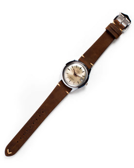 flatlay of the 1978 Timex Viscount M108, Accessories by Taylor Stitch