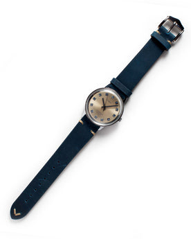 flatlay of the 1974 Timex Viscount M31, Accessories by Taylor Stitch