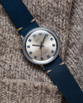 flatlay of the 1974 Timex Viscount M31 against a wool background, Accessories by Taylor Stitch