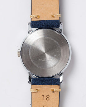 flatlay of the 1974 Timex Viscount M31, showing the back, Accessories by Taylor Stitch
