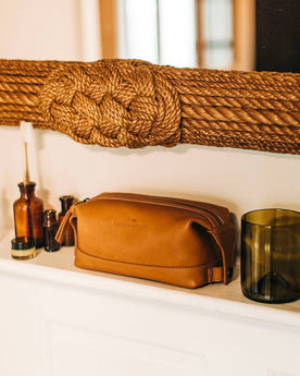 textural material shot of The Dopp Kit in Saddle Tan in bathroom, Accessories by Taylor Stitch