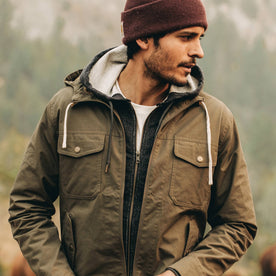 our fit model wearing The Welterweight Winslow in Olive Dry Waxed Canvas—looking right