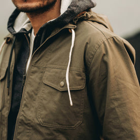 our fit model wearing The Welterweight Winslow in Olive Dry Waxed Canvas—cropped shot of chest