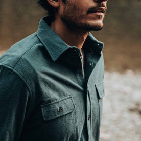 fit model wearing The Yosemite Shirt in Deep Ocean—looking right, cropped