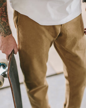 James about to skateboard , Pants by Taylor Stitch