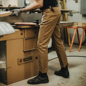 Our fit model wearing The Camp Pant in British Khaki Tuff Duck from Taylor Stitch.