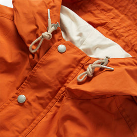 material shot of front placket and drawstrings of The Dalton Jacket in Rust