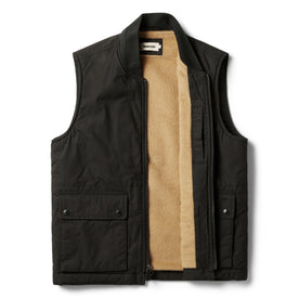 flatlay of The Ignition Vest in Coal Dry Wax open