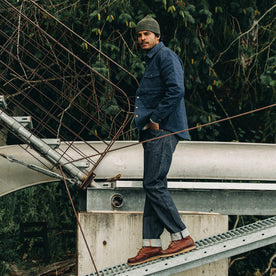 fit model wearing The Democratic Jean in Cone Mills Reserve Selvage, walking on dock
