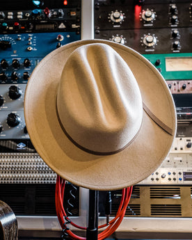 material shot of The Packable Lane Splitter in Mushroom, resting on recording equipment, Accessories by Taylor Stitch