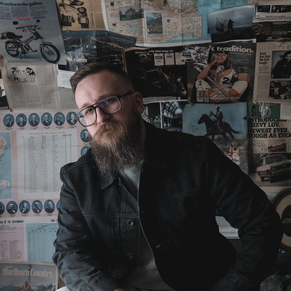 Lucas Fitz posing in The Ryder Jacket in Coal Chipped Canvas