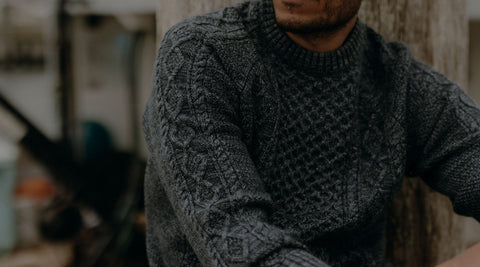 fit model posing in a grey sweater