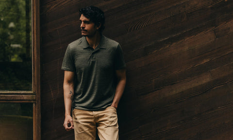 fit model posing in The Merino Polo in Heather Army
