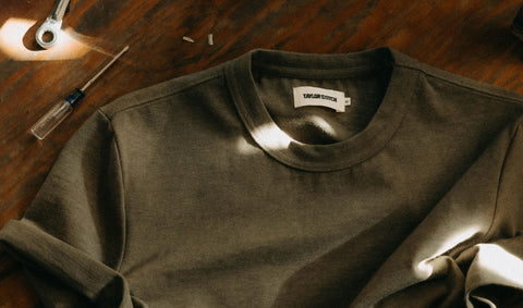 editorial flatlay of The Organic Cotton Shop Tee in Army Twist