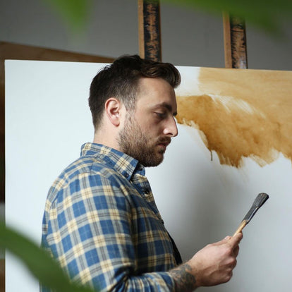 A man holding a paint brush