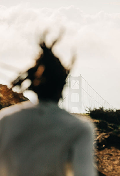 Man running toward the Golden Gate Bridge