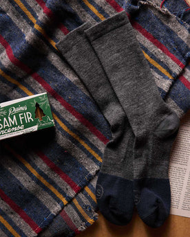 material shot of The Merino Sock in Charcoal next to incense, Accessories by Taylor Stitch