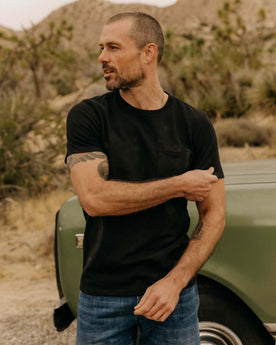 fit model posing in The Heavy Bag Tee in Black, Knits by Taylor Stitch