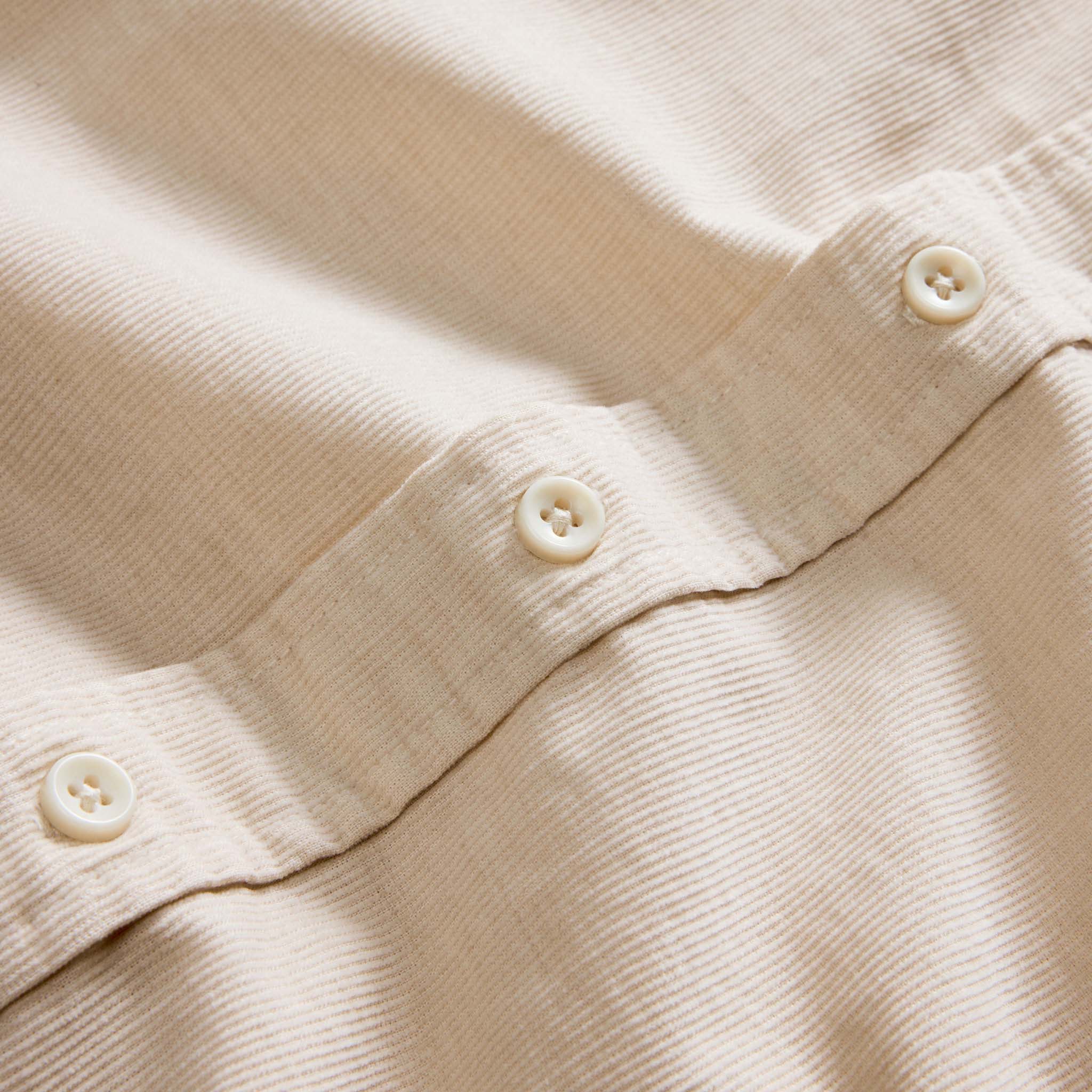 material shot of the buttons on The Jack in Oat Heathered Pincord, Wovens by Taylor Stitch